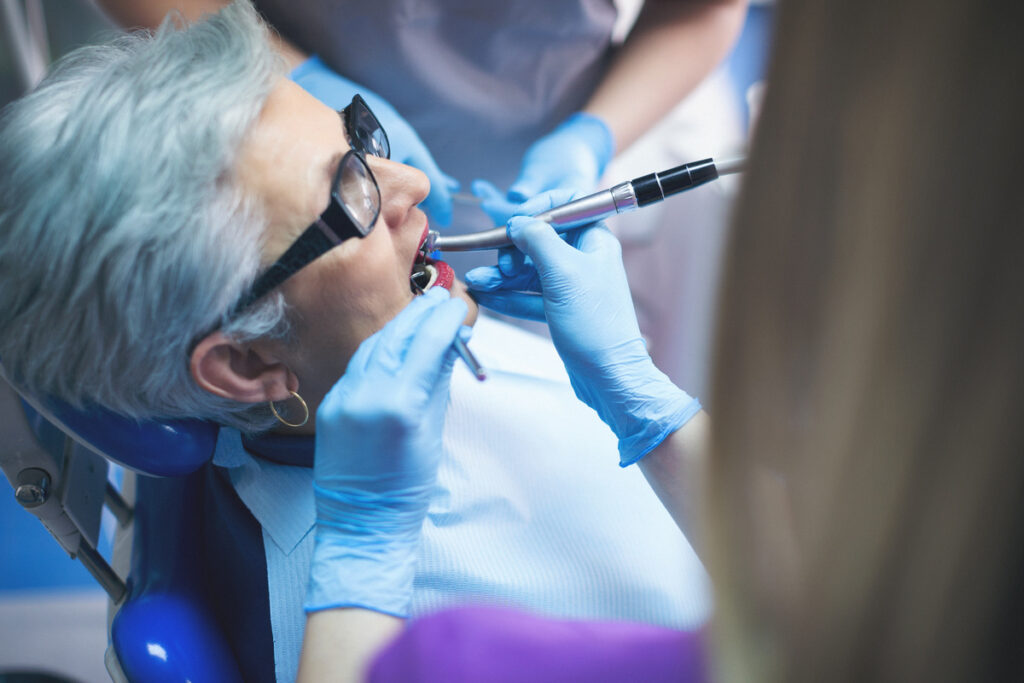Gray hair senior woman at dentist